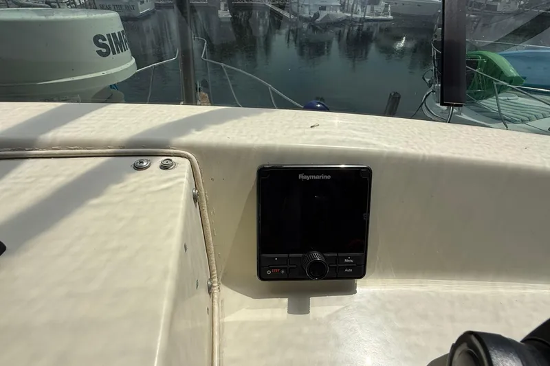 Slide: The Image of 1985 Tollycraft 34 Sundeck Motor Yacht helm with Raymarine navigation system. - 12