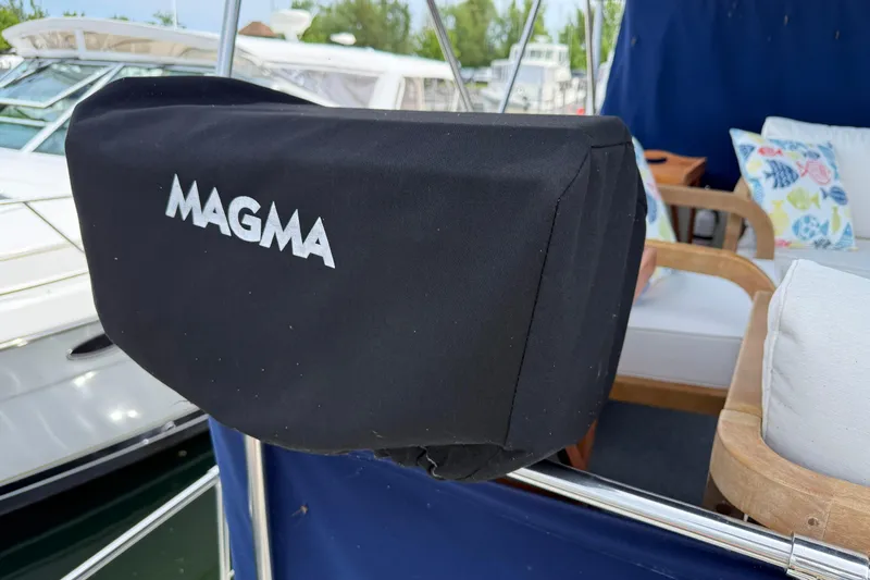Slide: The Image of Magma grill cover on 1985 Tollycraft 34 Sundeck Motor Yacht deck. - 7