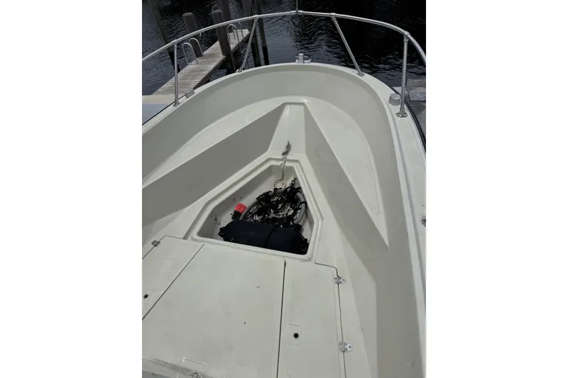 Slide: The Image of 1983 Boston Whaler 21 Outrage boat interior with open storage compartment. - 9