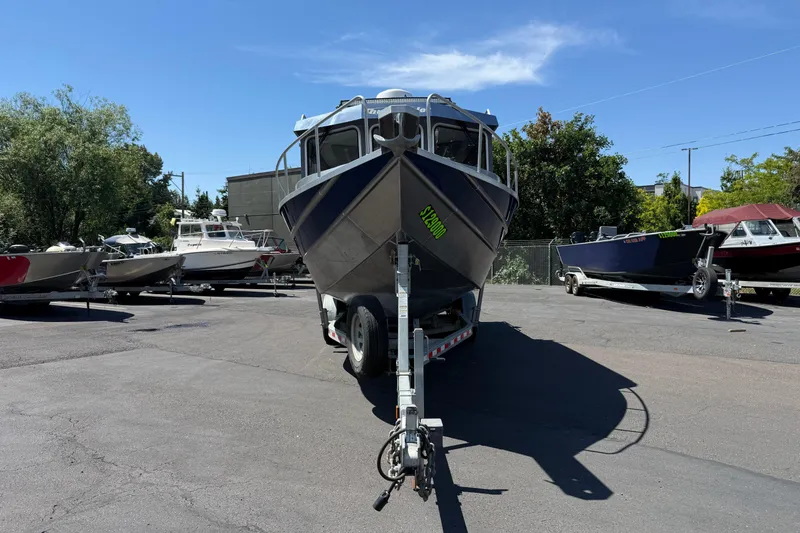 Slide: The Image of 2018 Thunder Jet Pilot 26' boat on trailer in sunny outdoor lot. - 2