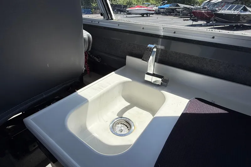 Slide: The Image of Interior sink of 2018 Thunder Jet Pilot 26' boat with chrome faucet. - 14