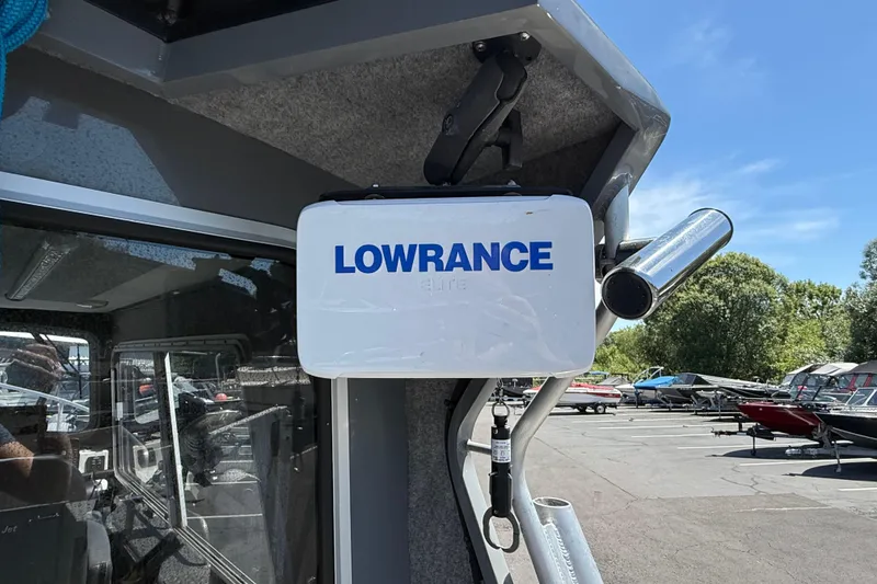 Slide: The Image of 2018 Thunder Jet Pilot 26' with Lowrance equipment, parked outdoors under clear sky. - 21