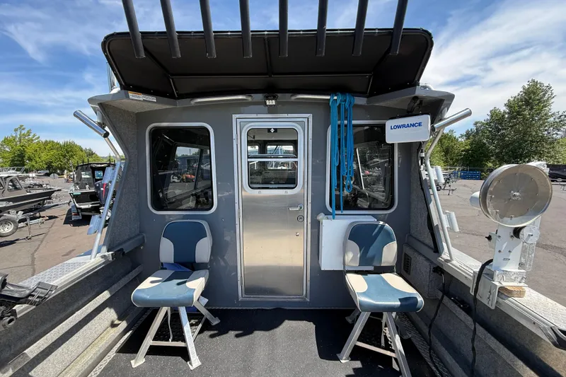 Slide: The Image of 2018 Thunder Jet Pilot 26' boat interior with seating and navigation equipment. - 5