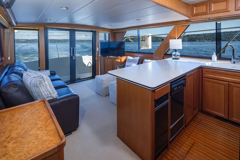Slide: The Image of Luxurious interior of 2000 Symbol 50 Pilothouse yacht with modern kitchen and scenic views. - 4