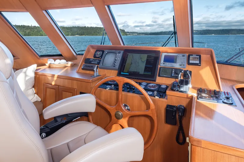 Slide: The Image of Pilothouse interior of 2000 Symbol 50, featuring navigation equipment and leather seating. - 9