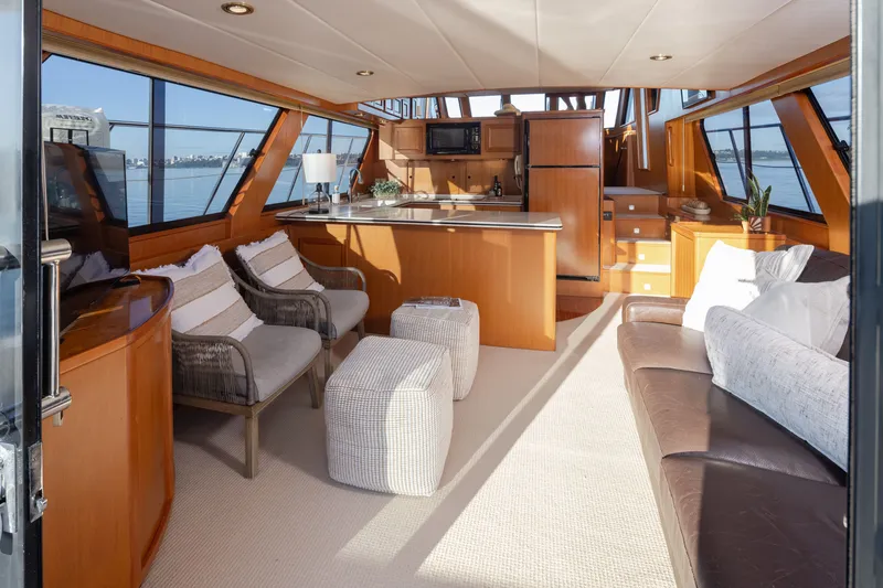 Slide: The Image of Luxurious interior of a 2000 Symbol 50 Pilothouse yacht with modern furnishings and panoramic windows. - 2