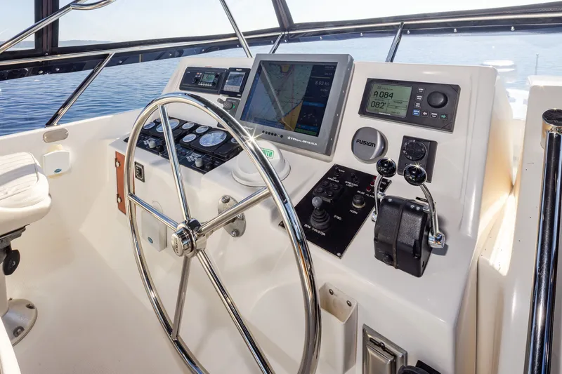 Slide: The Image of Helm of 2000 Symbol 50 Pilothouse yacht with navigation equipment and steering wheel. - 19