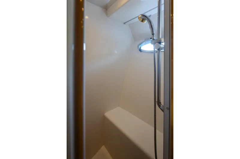 Slide: The Image of Shower area inside a 2000 Symbol 50 Pilothouse yacht, featuring a sleek design. - 14