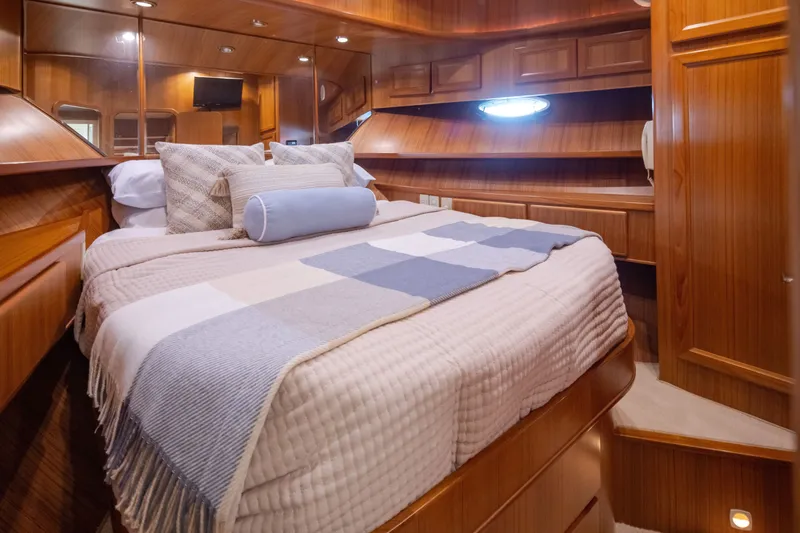 Slide: The Image of Luxurious cabin interior of a 2000 Symbol 50 Pilothouse yacht with cozy bedding. - 15