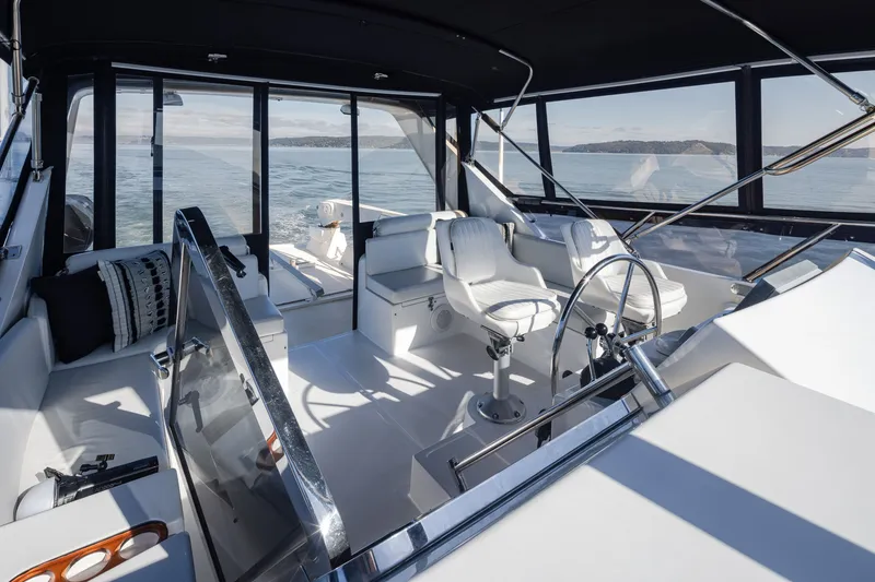 Slide: The Image of Luxurious interior of a 2000 Symbol 50 Pilothouse yacht with panoramic ocean views. - 20