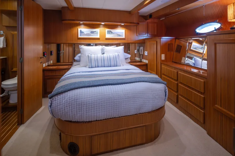 Slide: The Image of Luxurious cabin interior of a 2000 Symbol 50 Pilothouse yacht with elegant wood finishes. - 11