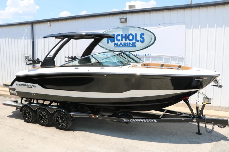 Slide: The Image of 2026 Chaparral 30 Surf boat on trailer at Nichols Marine dealership. - 4