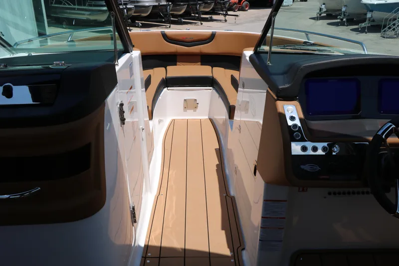 Slide: The Image of 2026 Chaparral 30 Surf boat interior with sleek design and modern dashboard controls. - 52