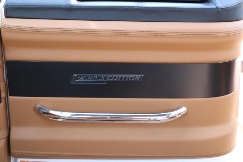 Slide: The Image of 2026 Chaparral 30 Surf Black Edition interior detail with chrome handle. - 35