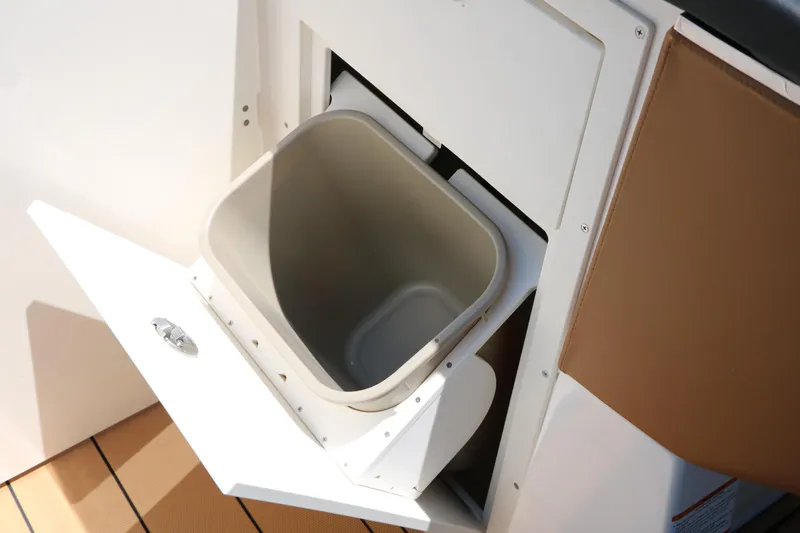 Slide: The Image of Built-in trash compartment on 2026 Chaparral 30 Surf boat, featuring sleek design and functionality. - 55