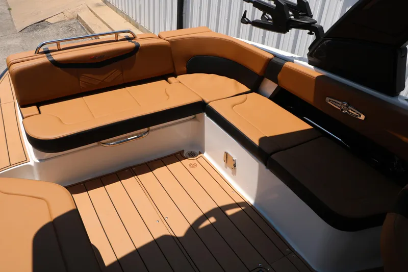 Slide: The Image of Luxurious seating area on 2026 Chaparral 30 Surf boat with tan upholstery. - 29