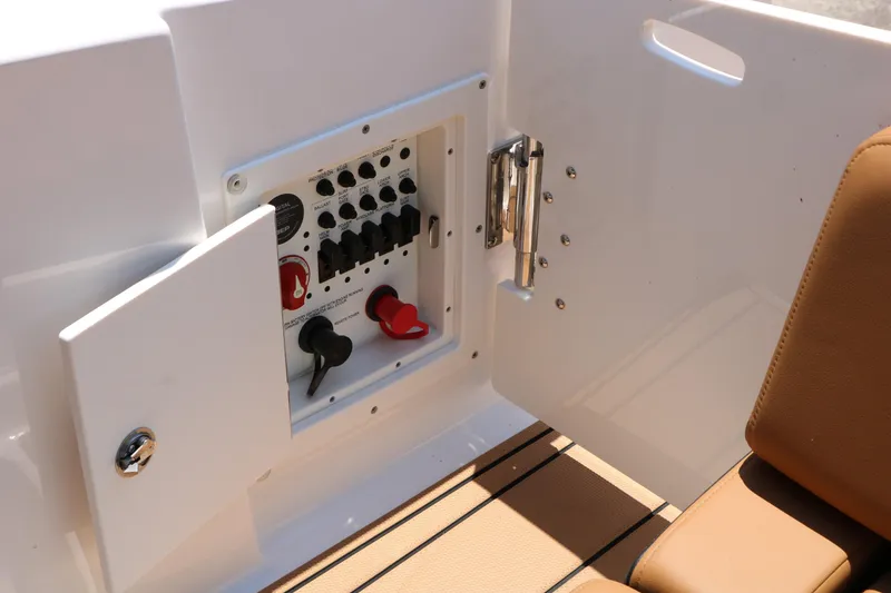 Slide: The Image of Control panel on 2026 Chaparral 30 Surf boat, featuring switches and seating area. - 27