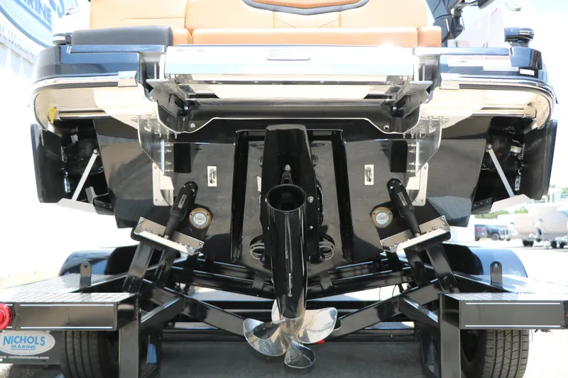 Slide: The Image of Rear view of 2026 Chaparral 30 Surf boat on trailer, showcasing propeller and hull design. - 11