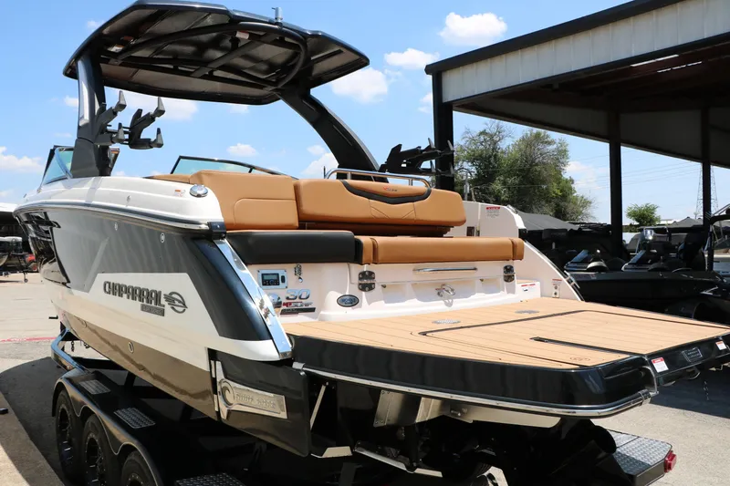 Slide: The Image of 2026 Chaparral 30 Surf boat with sleek design and spacious deck. - 19
