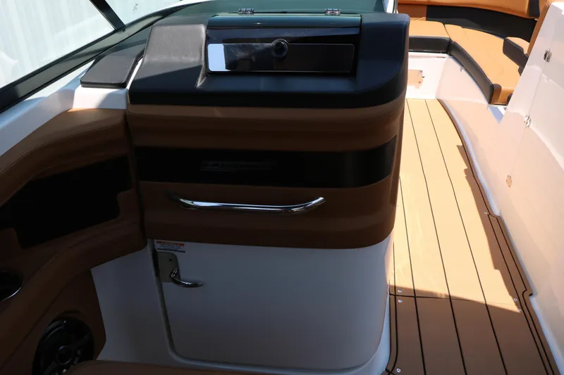 Slide: The Image of Interior view of 2026 Chaparral 30 Surf boat, featuring sleek design and wood accents. - 33