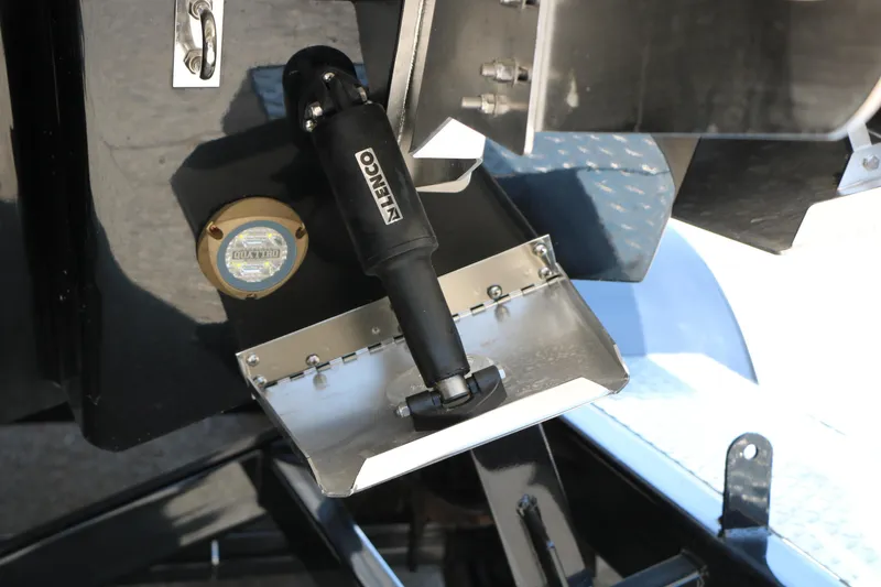 Slide: The Image of Close-up of 2026 Chaparral 30 Surf boat's Lenco trim tab system. - 12