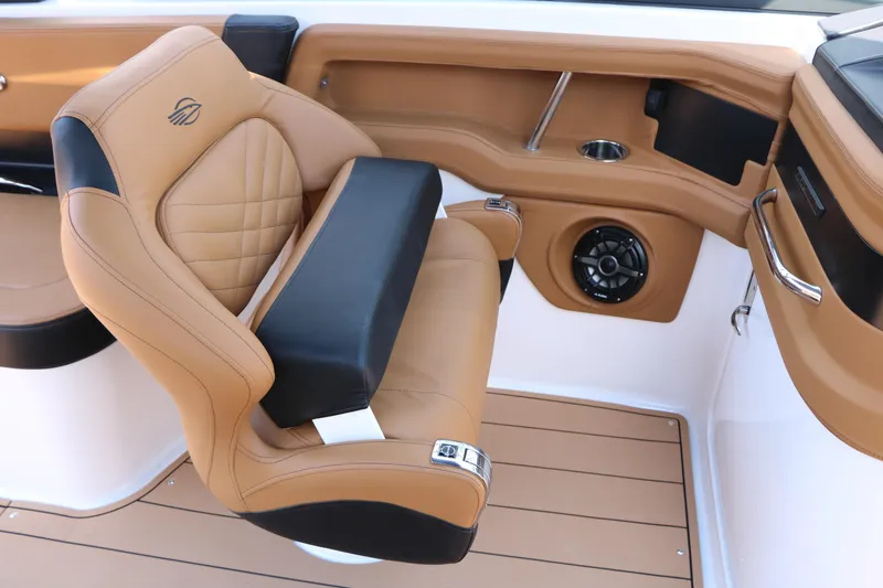 Slide: The Image of Luxurious tan and black seating in 2026 Chaparral 30 Surf boat interior. - 43