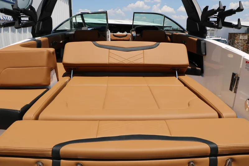 Slide: The Image of 2026 Chaparral 30 Surf boat interior with tan leather seating and modern design. - 25