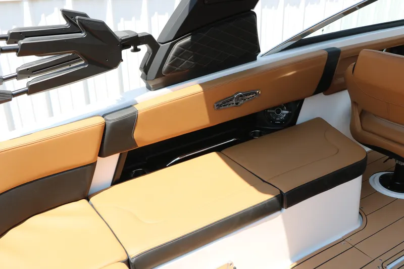 Slide: The Image of 2026 Chaparral 30 Surf boat interior with tan and black seating, sleek design. - 61