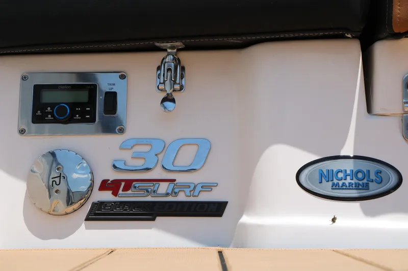 Slide: The Image of 2026 Chaparral 30 Surf Black Edition boat details with Nichols Marine logo. - 10