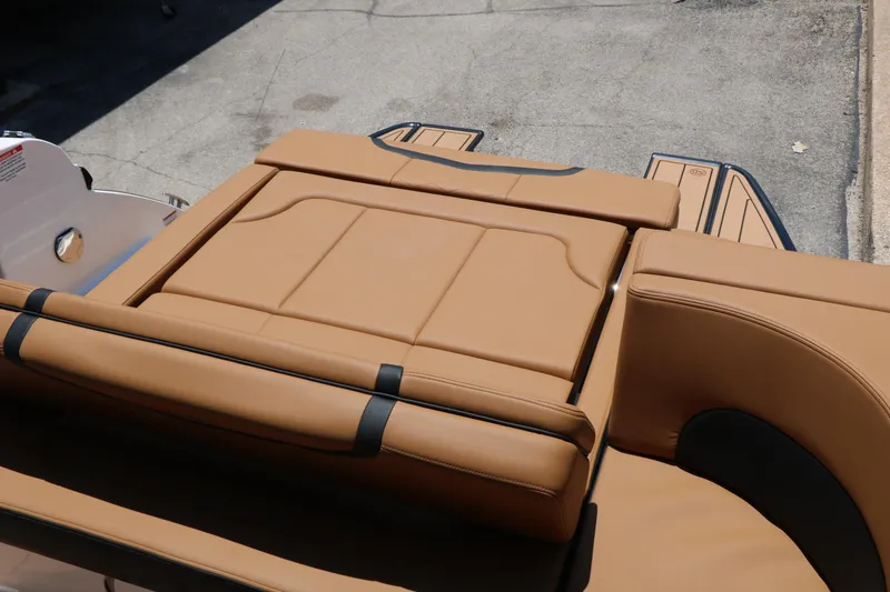 Slide: The Image of 2026 Chaparral 30 Surf boat with tan leather seating and sleek design. - 26