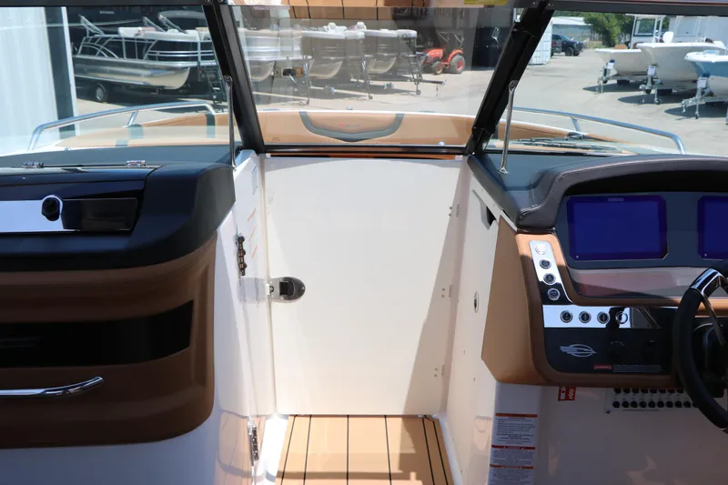 Slide: The Image of Interior view of 2026 Chaparral 30 Surf boat cockpit with modern controls. - 50