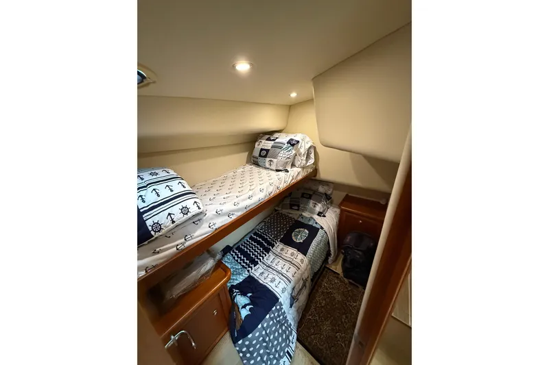 Slide: The Image of Cozy cabin with bunk beds in 2005 Riviera 40 Flybridge yacht. - 8