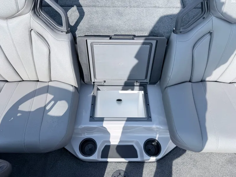 Slide: The Image of Interior view of a boat with gray seats and a central storage compartment. - 2