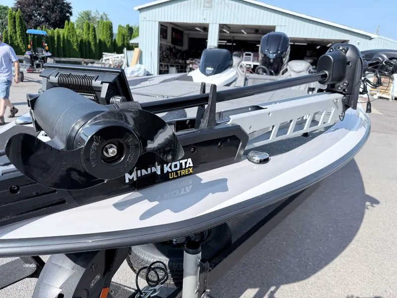 Slide: The Image of A Skeeter ZXR20 SE boat with a Minn Kota Ultrex motor, parked on a trailer. - 8