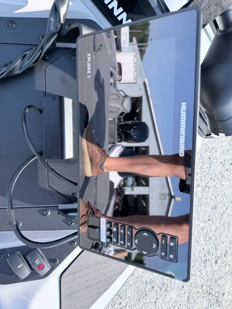 Slide: The Image of Close-up of a boat display reflecting a man and building. - 17
