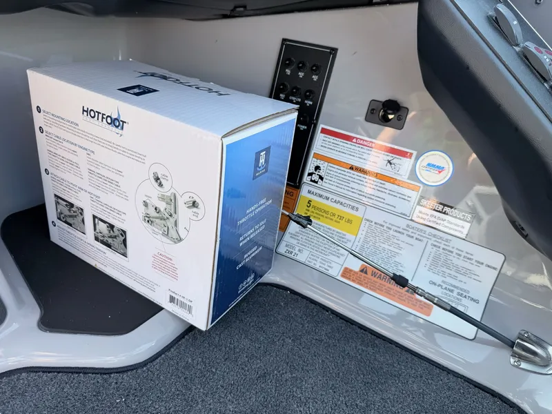Slide: The Image of Interior view of a boat with a Hotfoot package and safety labels. - 7