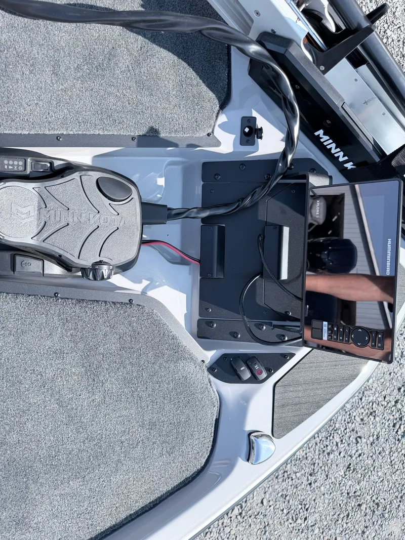 Slide: The Image of The image shows the cockpit of a Skeeter ZXR20 SE boat with a Minn Kota trolling motor and a screen. - 5