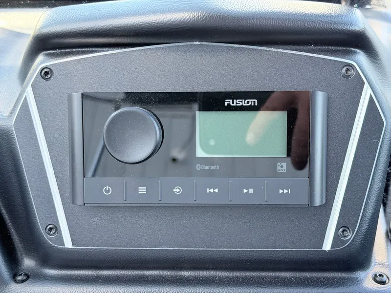 Slide: The Image of The image shows a Fusion audio system in a Skeeter Solera 205 boat. - 10