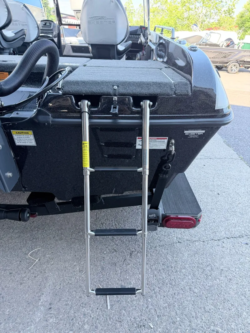 Slide: The Image of A 2025 Skeeter Solera 205 with a retractable ladder at the stern. - 27