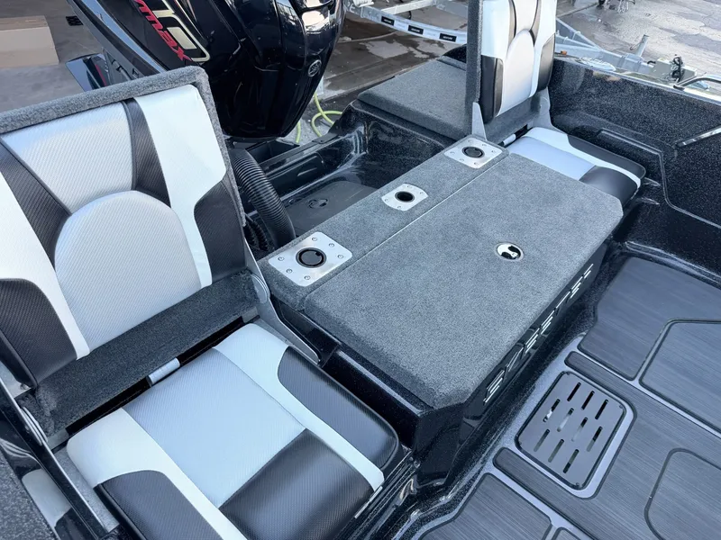 Slide: The Image of Interior of a Skeeter Solera 205 with two cushioned seats and a central storage area. - 40