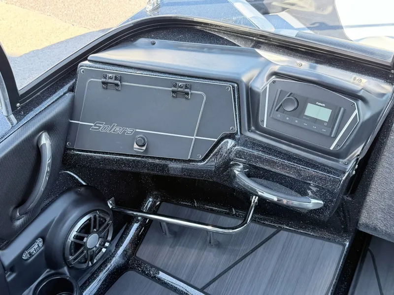 Slide: The Image of The image shows the dashboard of a Skeeter Solera 205 boat with speaker and controls. - 20