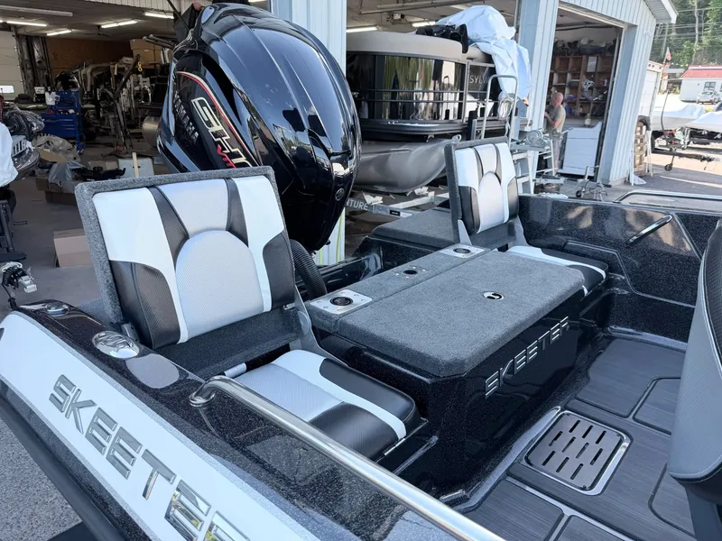 Slide: The Image of The image shows the rear of a Skeeter Solera 205 boat with two seats and an outboard motor. - 9