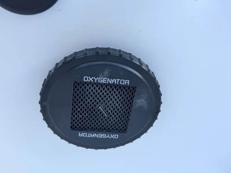 Slide: The Image of Close-up of a black oxygenator device on a boat. - 22