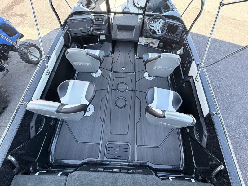 Slide: The Image of Interior view of a modern boat with four gray seats and a helm station. - 8