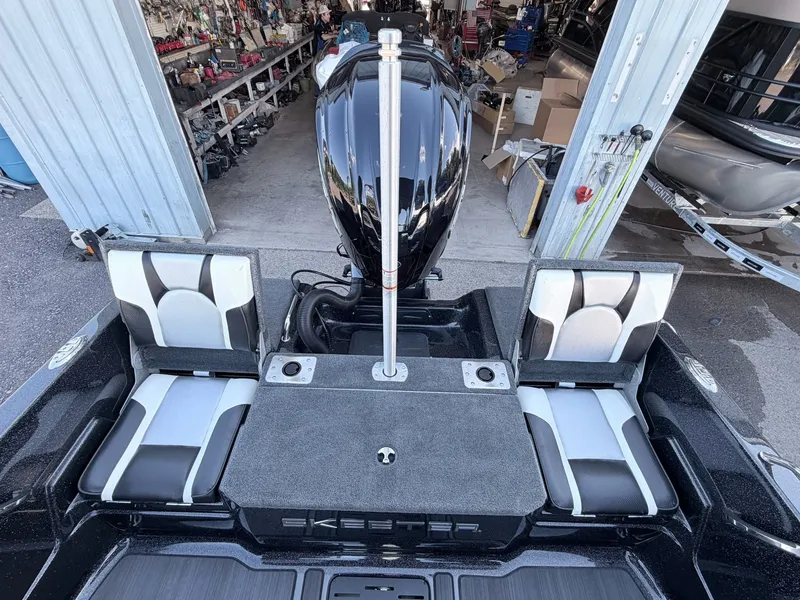 Slide: The Image of The image shows the rear of a Skeeter Solera 205 boat with an outboard motor. - 19