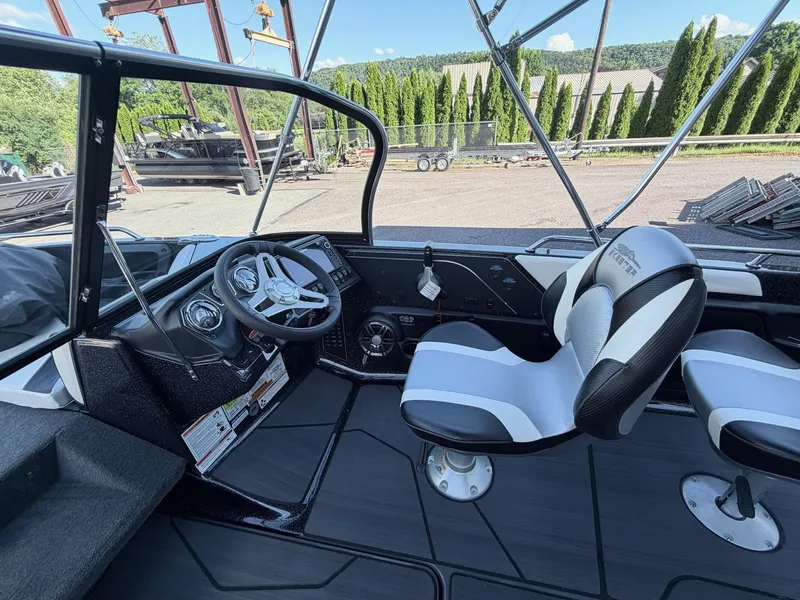 Slide: The Image of The image shows the cockpit of a Skeeter Solera 205 boat with two seats and a steering wheel. - 39