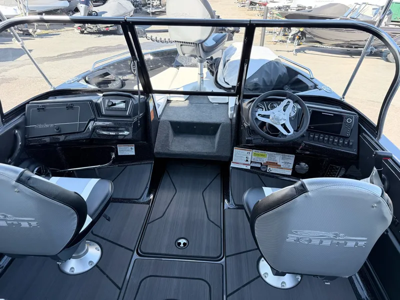 Slide: The Image of The image shows the cockpit of a 2025 Skeeter Solera 205 boat with two seats. - 11