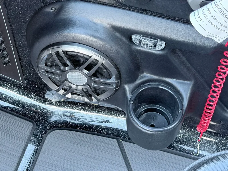 Slide: The Image of Close-up of a speaker and cup holder on a boat. - 18
