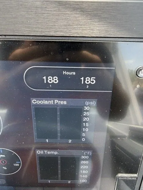 Slide: The Image of Close-up of a boat display showing engine hours, coolant pressure, and oil temperature. - 26