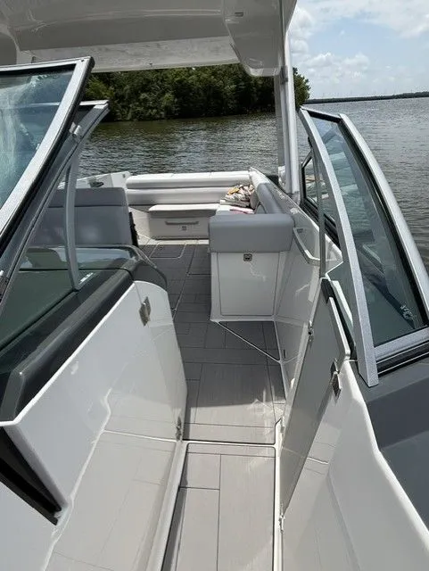 Slide: The Image of The image shows the deck of a 2021 Aviara AV32 on calm waters. - 17